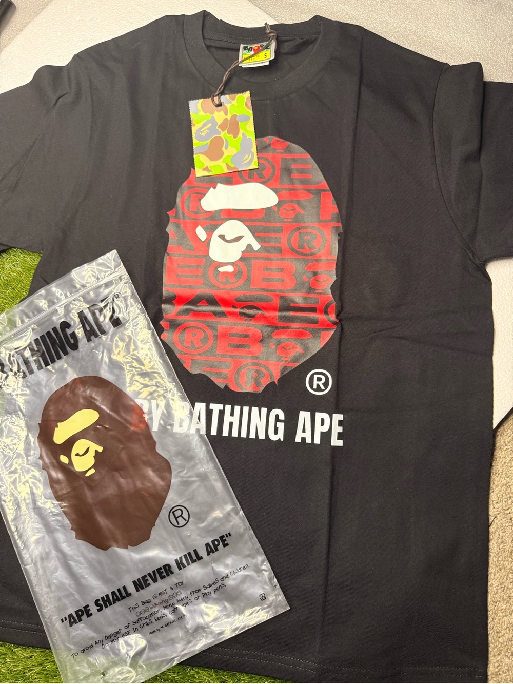 Bape Black Short Sleeve Tee with Red and White Ape Head Graphic